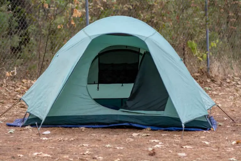 putting a tarp under a tent